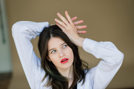Emotional portrait of surprised woman. Amazement emotion. Studio isolated shot.