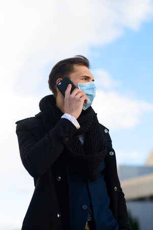 People with face mask. Concept with copy space. Portrait of adult man in quarantine of flu. Photo on...