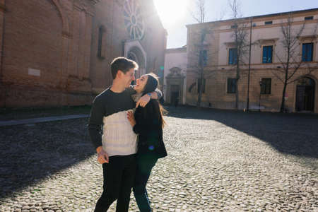 Bologne, Italy - 02.05.2020. Young fashion couple walking down the street in summer in europe.のeditorial素材