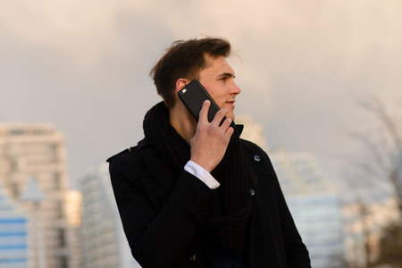 Young man on the street with mobile phone