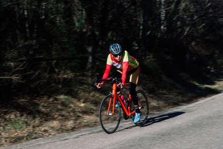 Bologne, Italy - 02.03.2020. Professional cyclist riding racing bike in competition on open road.のeditorial素材