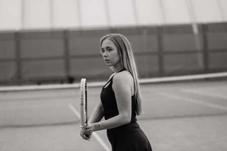 Tennis tournament. Female player at clay tennis courtの写真素材