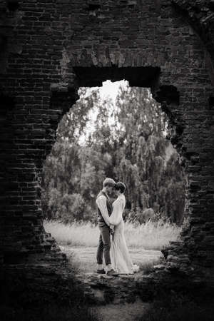 Very nice redhead young just married happy couple kissing in the sunset outdoorsの写真素材