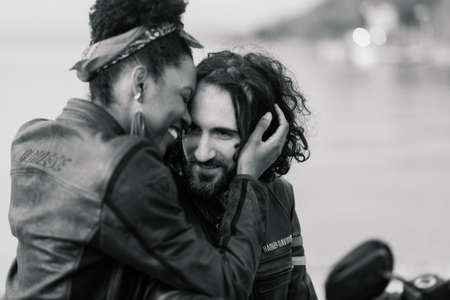 Milan, Italy - 02.05.2020. An interracial couple enjoy a summers day while riding their motorcycleのeditorial素材