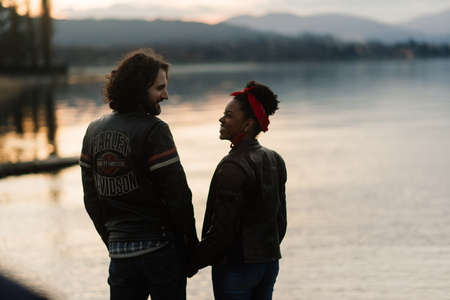 Milan, Italy - 02.05.2020. An interracial couple enjoy a summers day while riding their motorcycleのeditorial素材