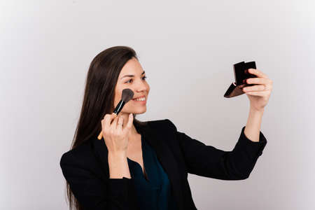 Cosmetologist beautician holding a tool in her hands, permanent makeup master, permanent makeup, tattoo pen, close upの写真素材