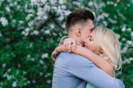 Loving couple kissing on the nature, summer evening, sunsetの写真素材