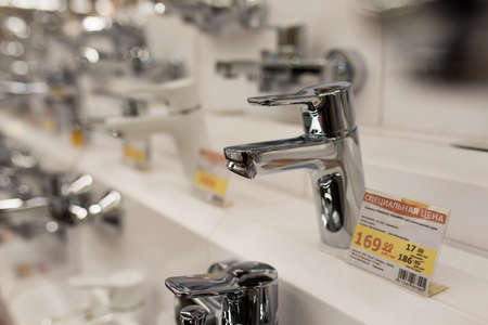 Minsk, Belarus - 12.13.2020. Various new faucets in construction store.のeditorial素材