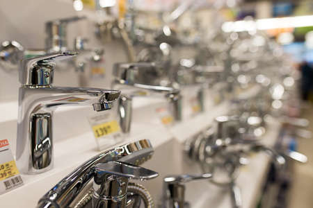 Minsk, Belarus - 12.13.2020. Various new faucets in construction store.のeditorial素材