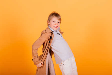 Red hair boy surprise emotions hands on head and wide open mouth, human facial emotionsの写真素材