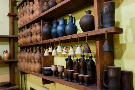 Minsk, Belarus - 01.23.2021. Handmade pottery jug. Raw handicraft clay brown tableware, earthenware jug before firing in pottery workshop. Ceramics product concept.のeditorial素材