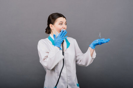 Doctor scientist with syringe analyzing virus Sars-CoV-2 in research for vaccine to be ready for clinical trial. Female researcher testing at the labの写真素材
