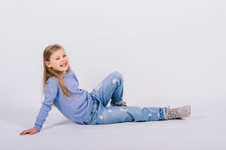 Portrait of beautiful and confident girl showing thumbs up isolated one white