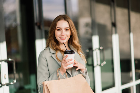 Happy woman with shopping bags enjoying shopping. Consumerism, lifestyle conceptionの写真素材