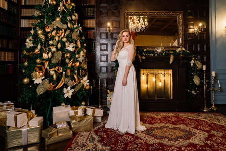 Minsk, Belarus - 11.26.2020. Bride on the background of new year lights, christmas interiorのeditorial素材