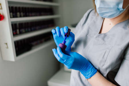 Styling nail color nail polish. Colored manicure, cosmetic colored lacquer painting nails.の写真素材