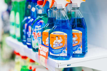 Minsk, Belarus - 03.07.2021. An assortment of washing powders of different brands on shelves in the store.のeditorial素材