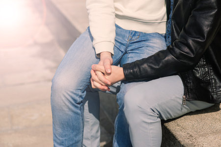 Young gay couple smiling happy and hugging at city.の写真素材