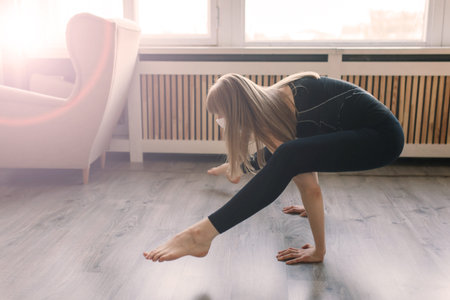 Meditating woman wearing a medical face mask to protect from  virus  , yoga position