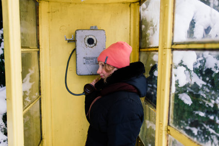 Vintage call-box, yellow telephone booth, retro payphone