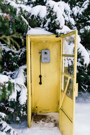 Minsk, Belarus - 02.24.2021. Vintage call-box, yellow telephone booth, retro payphoneのeditorial素材
