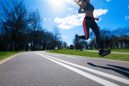 Woman runners morning exercise she wears a nose mask. Protection against dust and viruses
