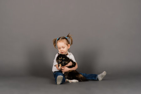 I love my kitten, little girl holds her new petの写真素材