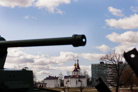 Fragment of a tracked track on a green camouflage tank.の写真素材