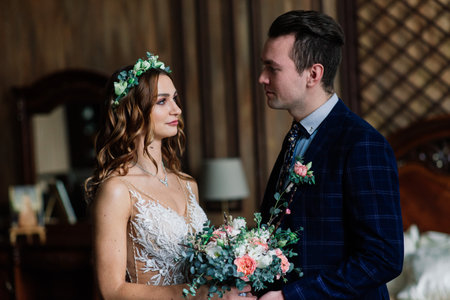 Bratislava, Slovakia - 03.10.2021. Emotional moment of meeting the bride and groom on their wedding day. A couple on walk, in Palaceのeditorial素材