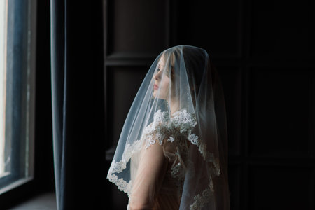 Beautiful young bride in a white lingerie. Last preparations for wedding. Girl is waiting for groom.