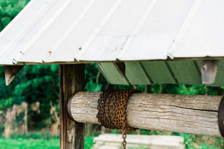 Old water well in a village, abandoned placeの写真素材