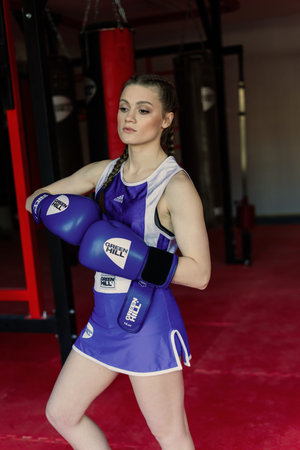 Bratislava, Slovakia - 05.25.2021. Attractive female training, punching a bag with boxing gloves onのeditorial素材