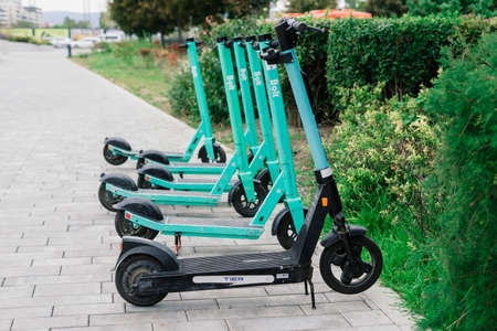Bratislava, Slovakia - 11.29.2021. Public rental electric kickboard, parking of scooters on a streetのeditorial素材