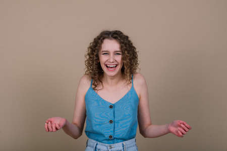 Emotional portrait of surprised woman. Amazement emotion. Studio isolated shot.の写真素材