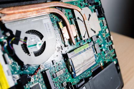Bratislava, Slovakia - 12.14.2021. Service engineer install new chips to laptop. Repairing and...