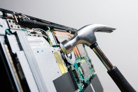 Bratislava, Slovakia - 12.14.2021. Service engineer install new chips to laptop. Repairing and...