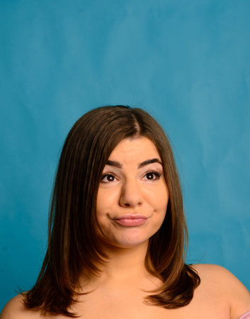Body positive. Beautiful woman in underwear, black and blue studio, an attractive plus size