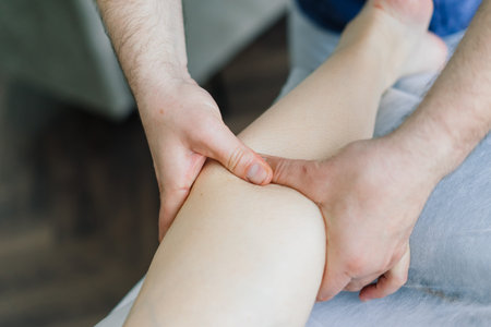 Anti-cellulite foot massage for fat woman. Concept of personal care, weight loss, diet. Close-up.