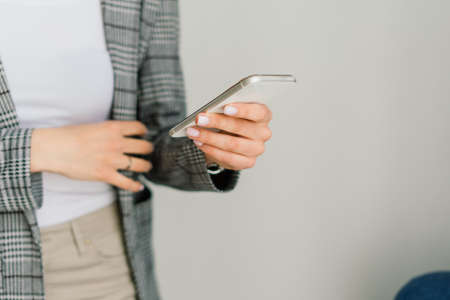 Young attractive european woman to see smart phone relaxing at homeの写真素材