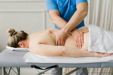 Anti-cellulite foot massage for a fat woman. Concept of personal care, weight loss, diet. Close-up.の写真素材