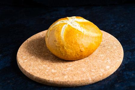 Fresh white bread and milk in white glass on black stone table background. Top view, croissantの写真素材