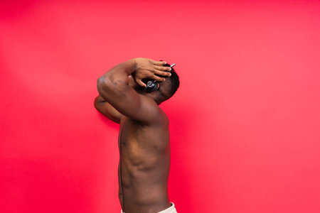 Like what you see. A handsome and muscular young man posing in the studio.の写真素材