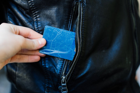 From the pocket of jacket the thief pulls out a card banknote money purse wallet.の写真素材