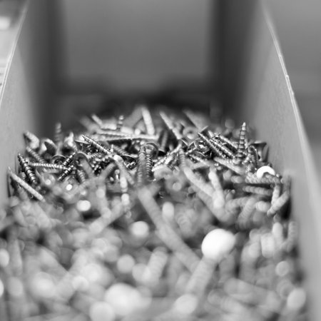 Silver grey self-tapping screws as industrial background. Close up.の写真素材