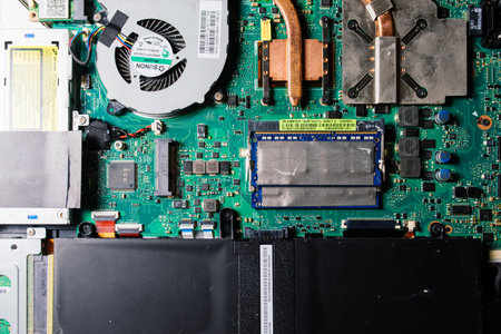 Prague, Czechia - 7th May 2022 Hand technician repairing broken laptop notebook computer with a screwdriverのeditorial素材