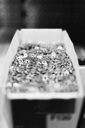 Silver grey self-tapping screws as industrial background. Close up.