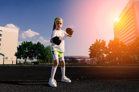 Female child boxer in gloves, feminism concept. Back to school, physical training lesson.の写真素材
