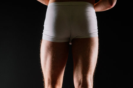 Panties on sexual body. Guy or sexy macho with strong muscles, Athlete wearing white underwear.の写真素材