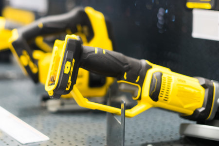 Power tools, drills and hammers of various manufacturers are sold in a hardware store.