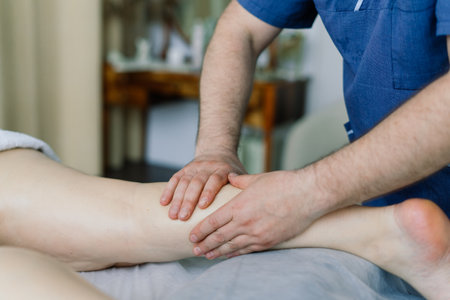 Woman receiving cupping on back at spa for joint pain reliefの写真素材